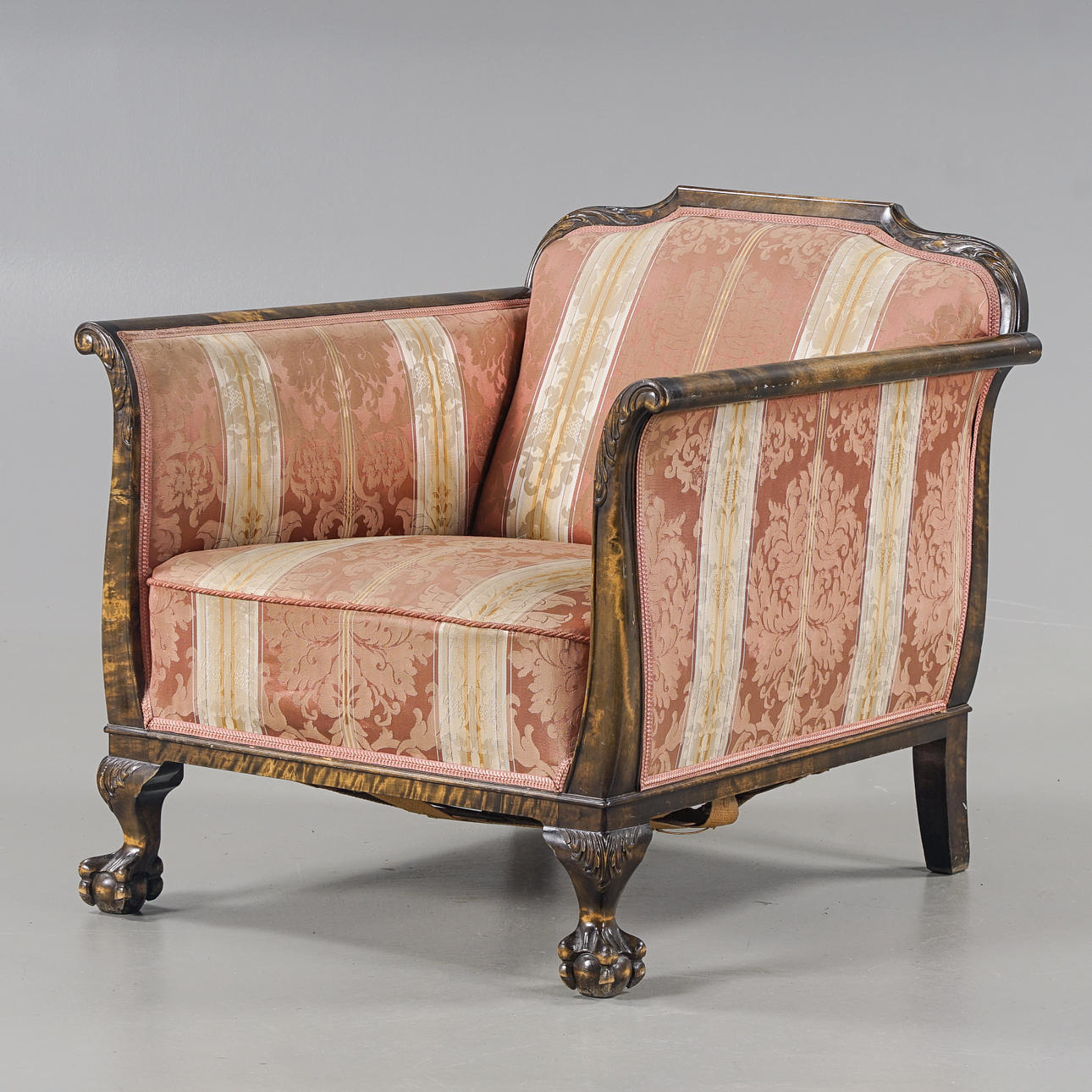 A 1930s Chippendale-style armchair.