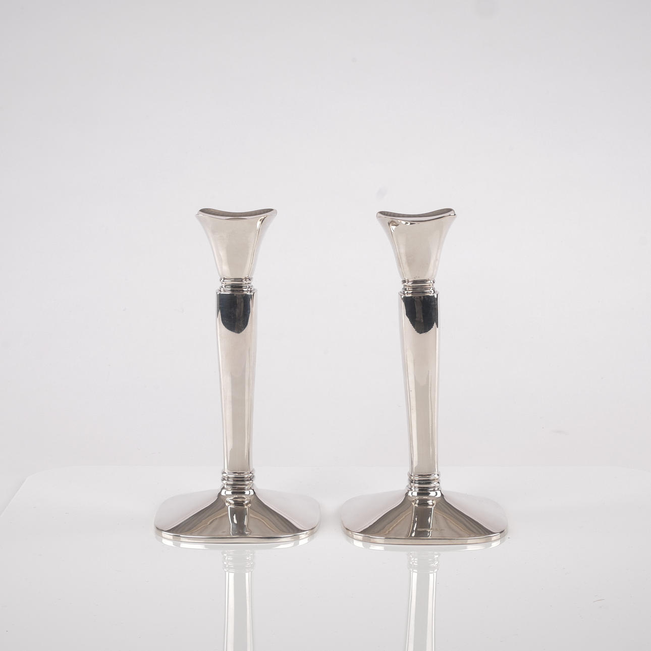CANDLESTICKS, a pair, silver with filling.