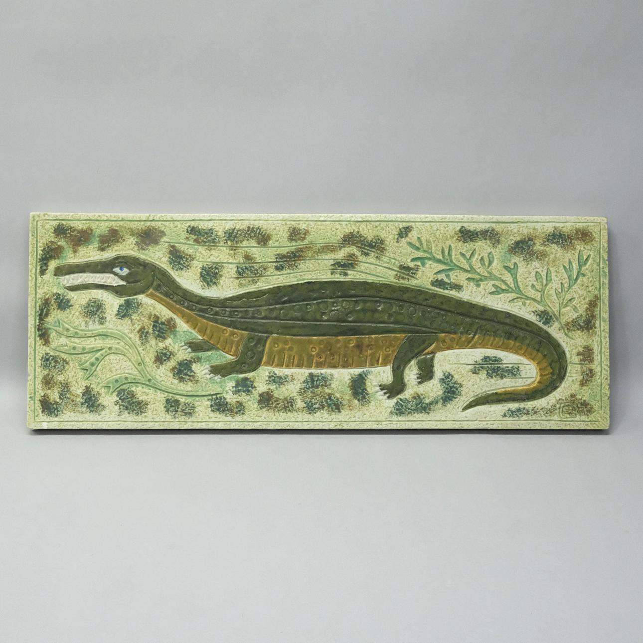 GUNNAR NYLUND. RELIEF WITH LIZARD, SCANISAURUS.