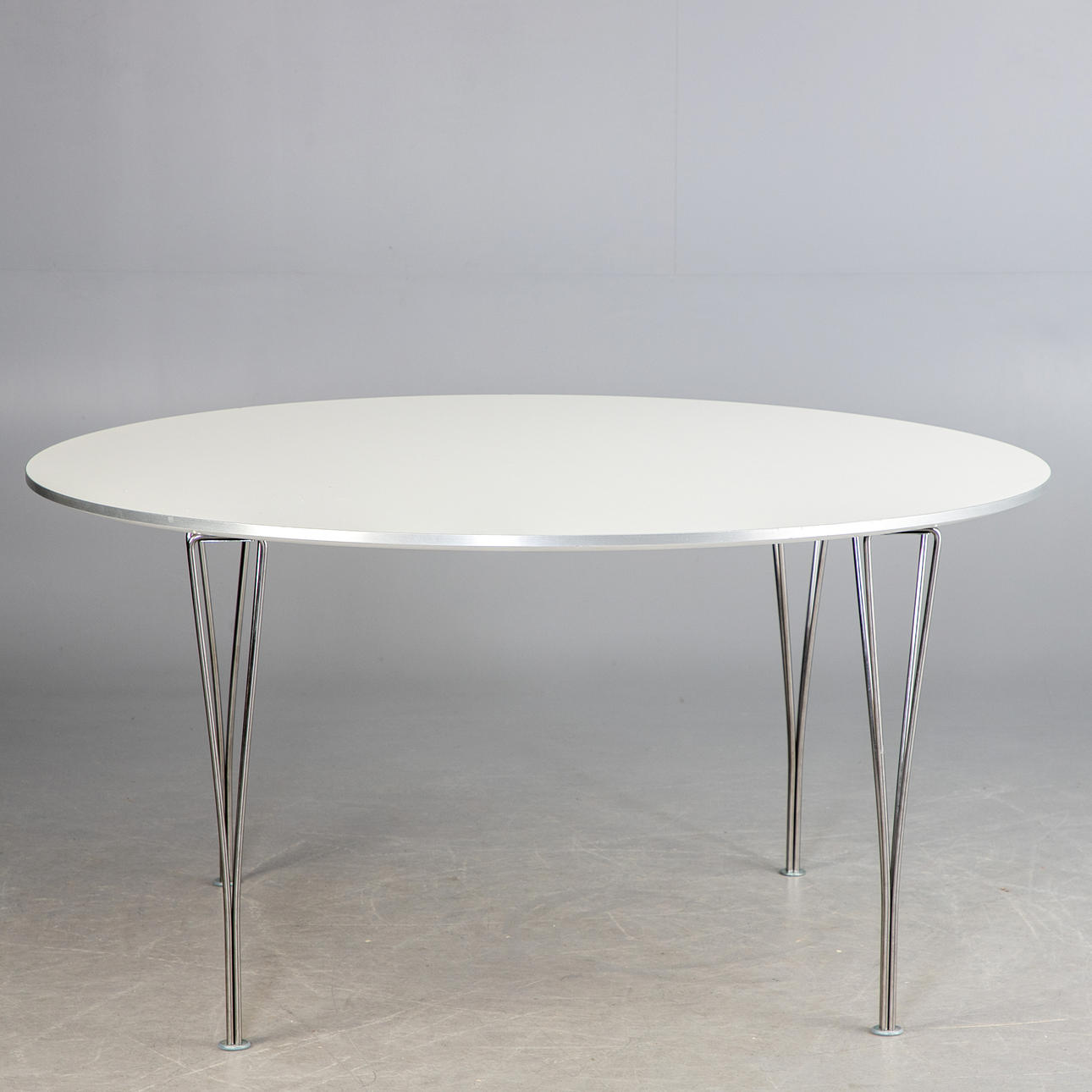 PIET HEIN, BRUNO MATHSSON UND ARNE JACOBSEN. Fritz Hansen. “Supercircular” table.