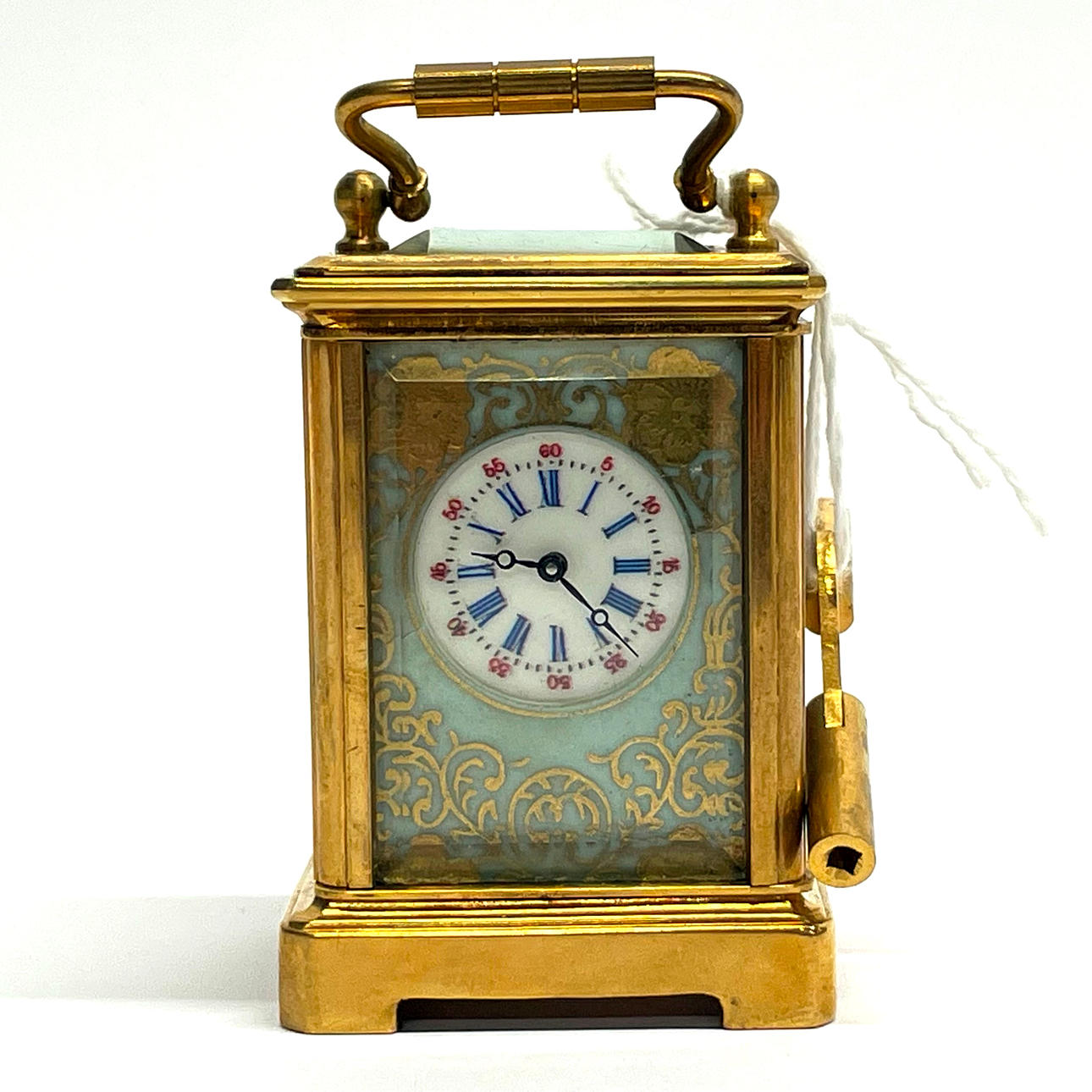 MINIATURE PORCELAIN CARRIAGE CLOCK.