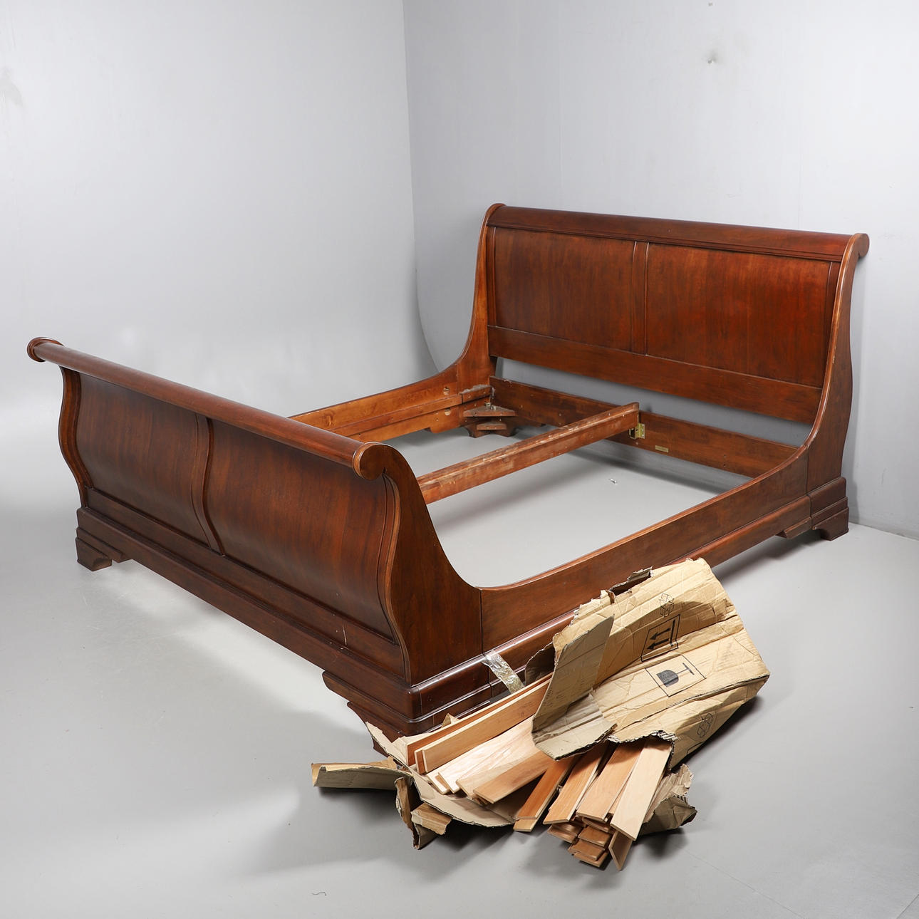 A JOHN LEWIS SLEIGH BED.