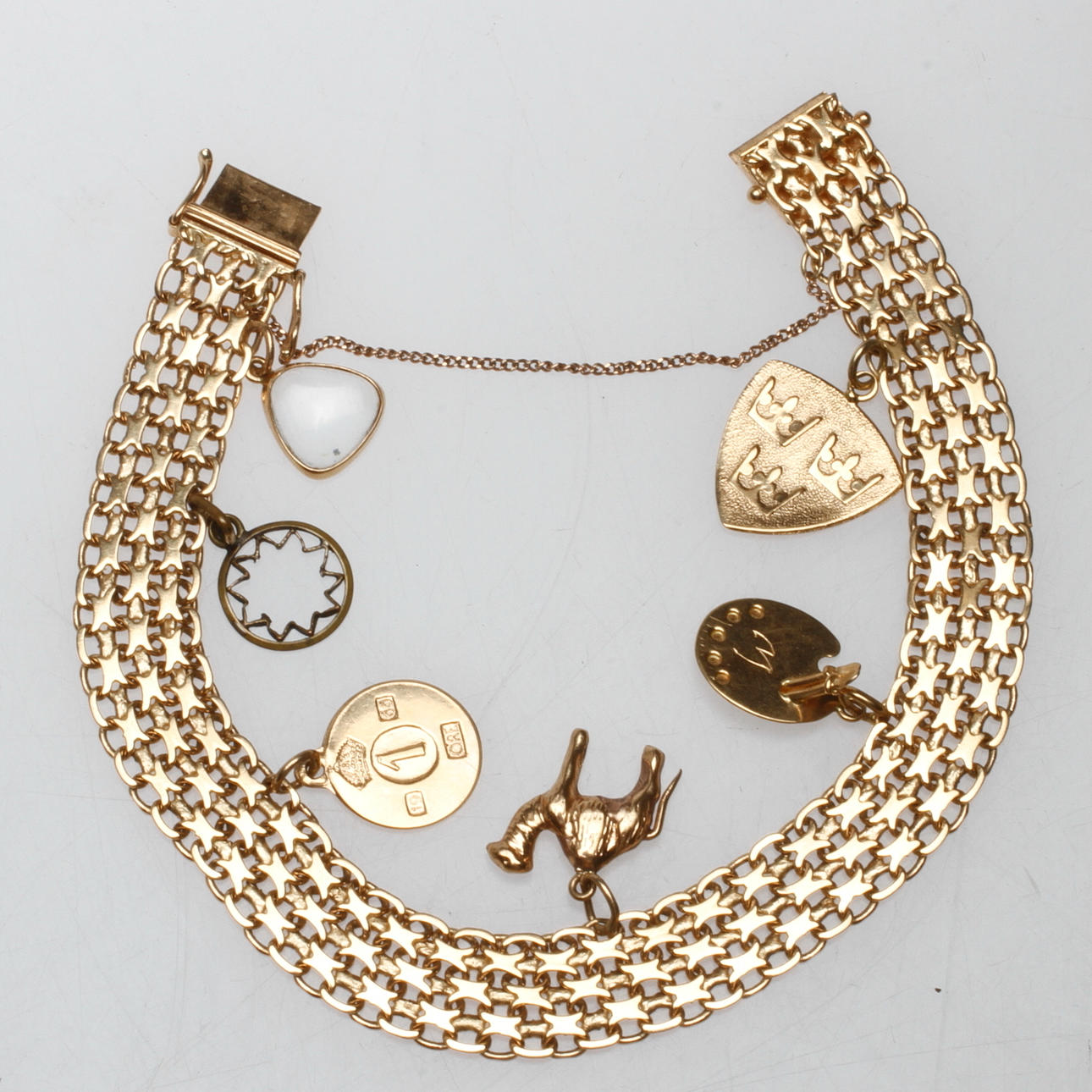 ARMBAND MED BERLOCKER, "X-länk", 18k, guld, Boliden, vikt ca. 19,4 gram.