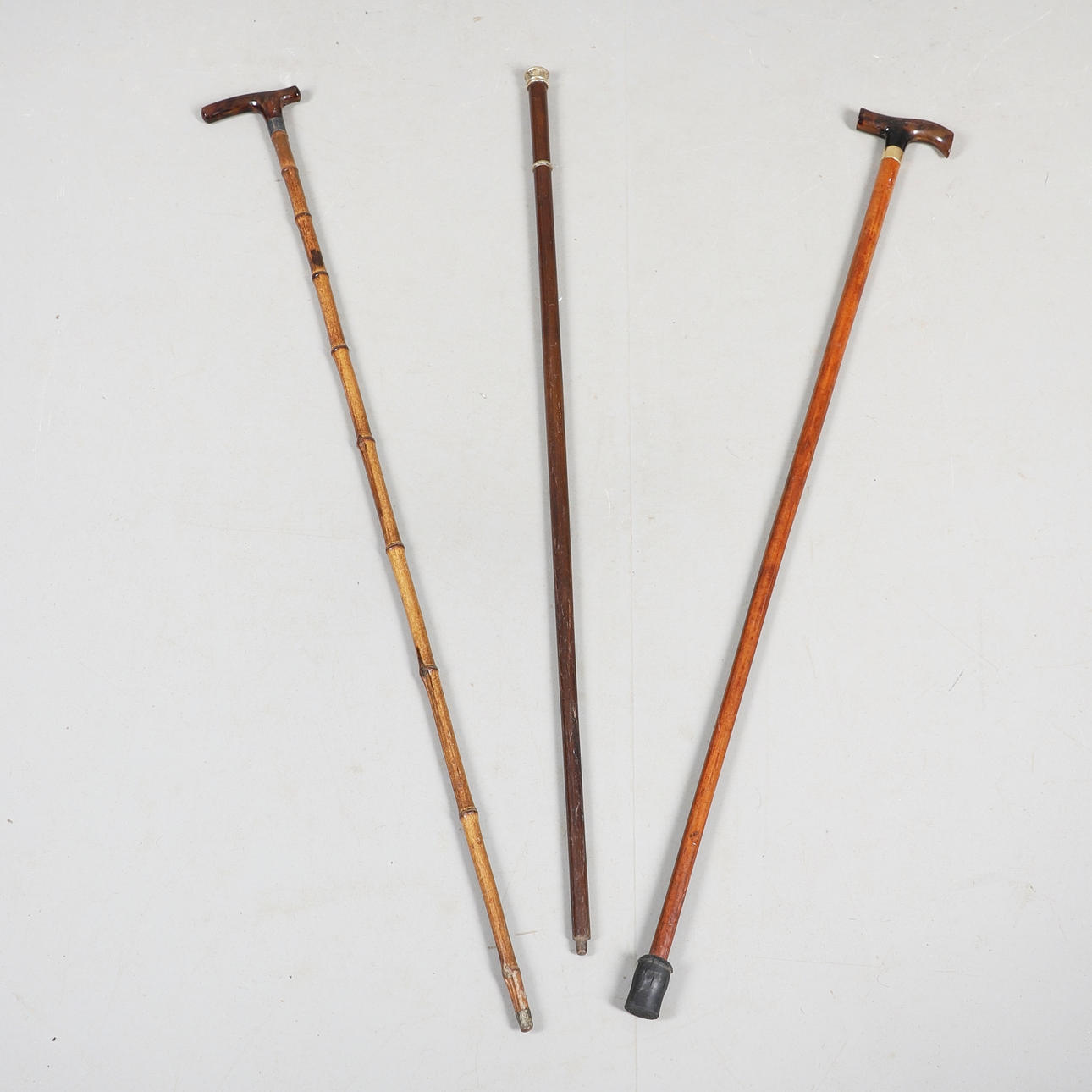 ANTIQUE WALKING CANES INCLUDING CREST.
