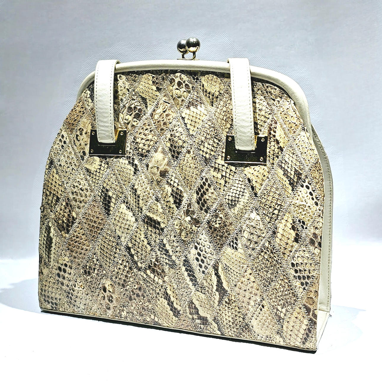 Double-handle patchwork bag in gray snake foot.