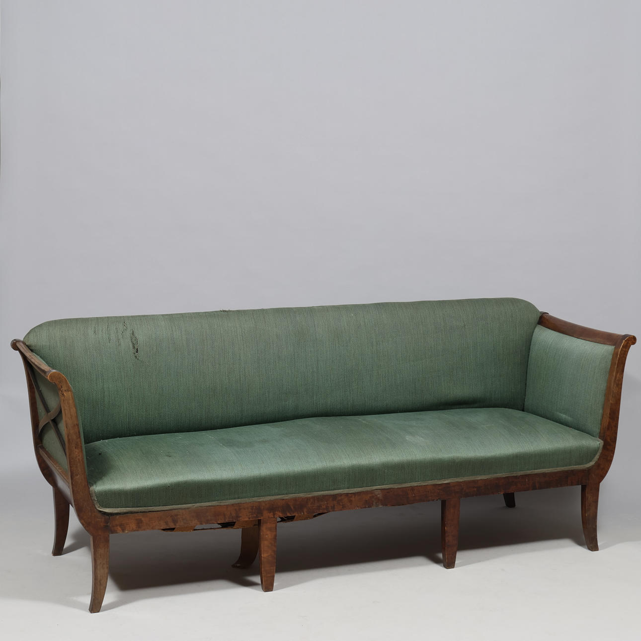 Sofa of stained mahogany, upholstered in green fabric, Danish cabinetmaker, first half of the 20th century.