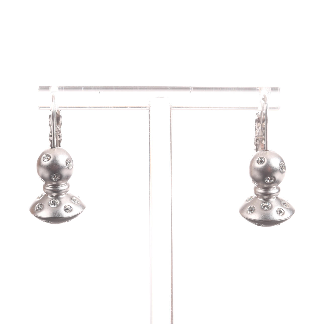 A pair of silver Swarowski earrings.