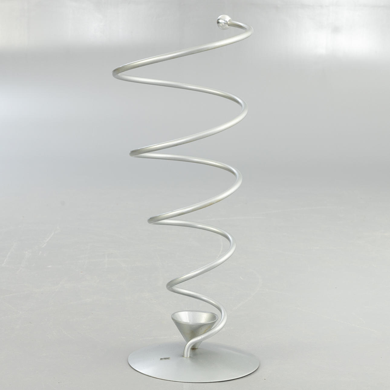 MARKUS BÖRGENS. D-tec. “Spring” aluminium umbrella stand, 1990s.