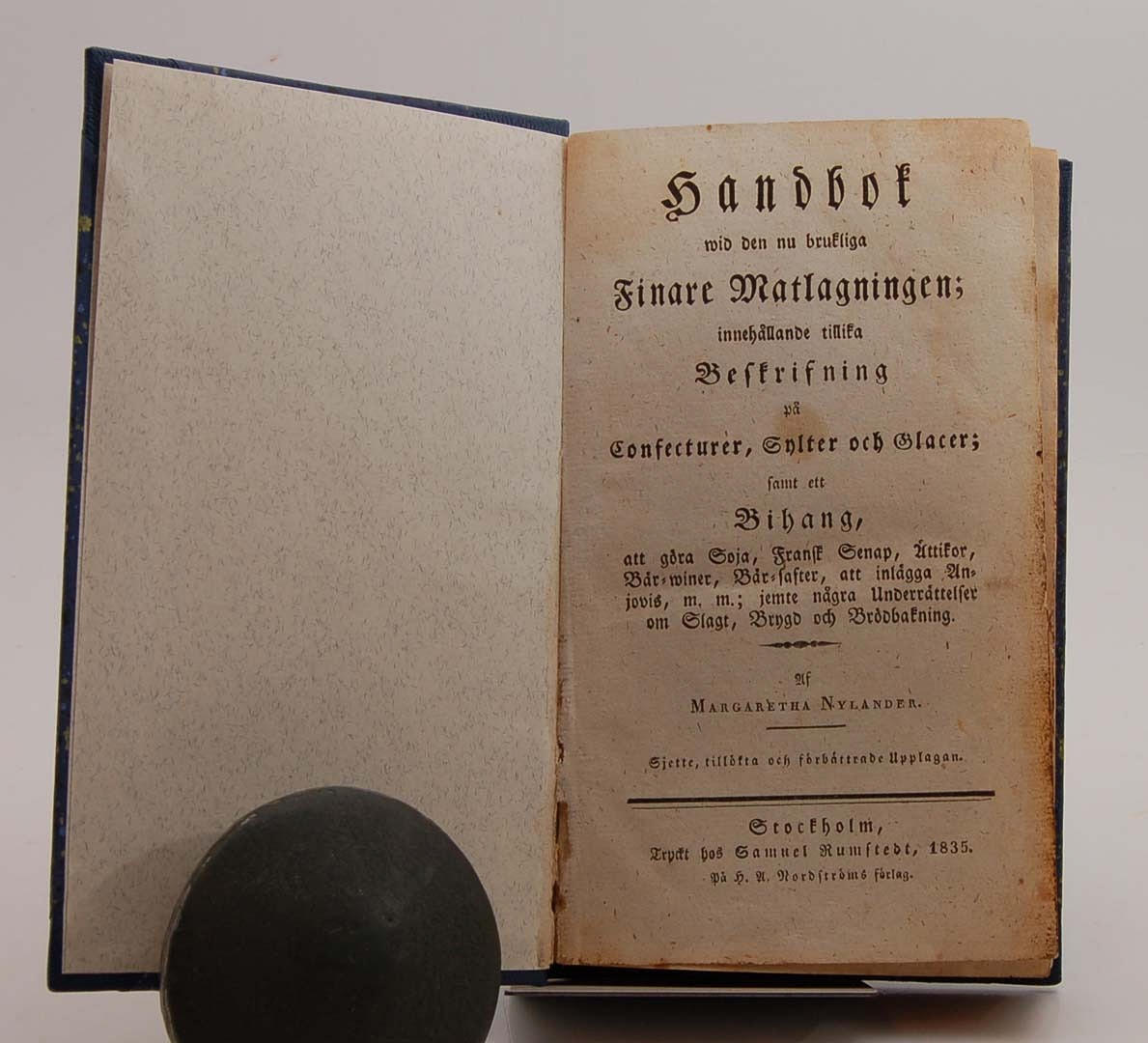 NYLANDER, MARGARETHA. Handbok vid den nu brukliga finare matlagningen, 1835.