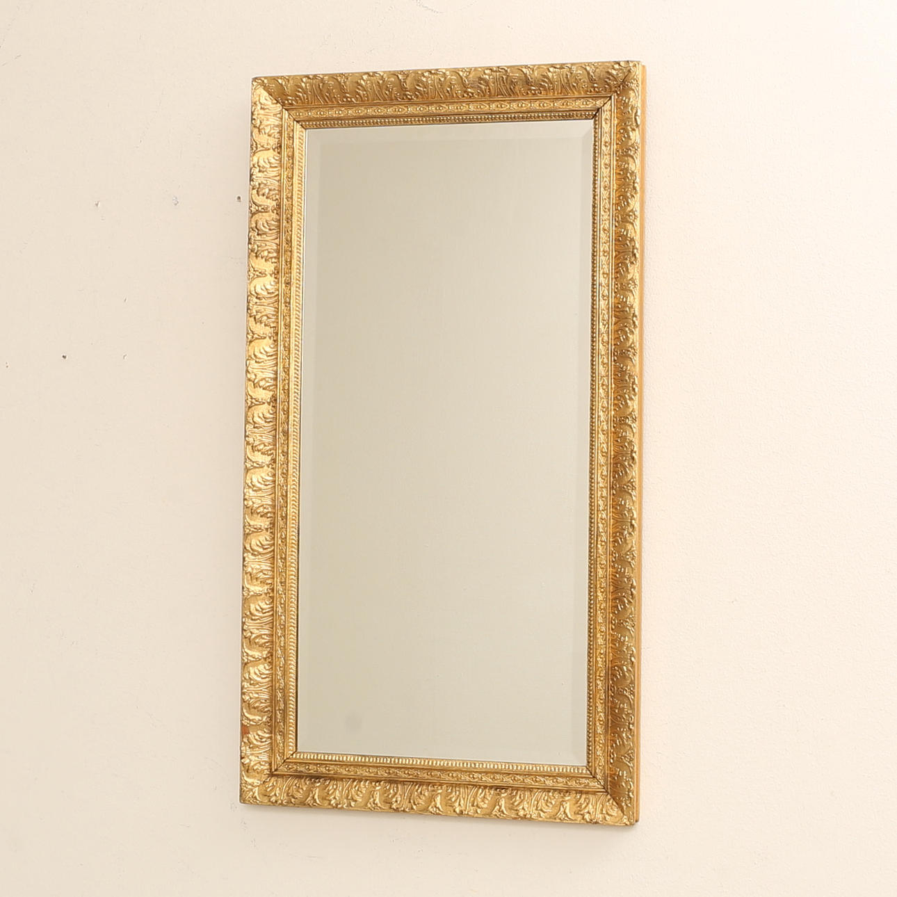 A mirror, bronzed, 20th century.