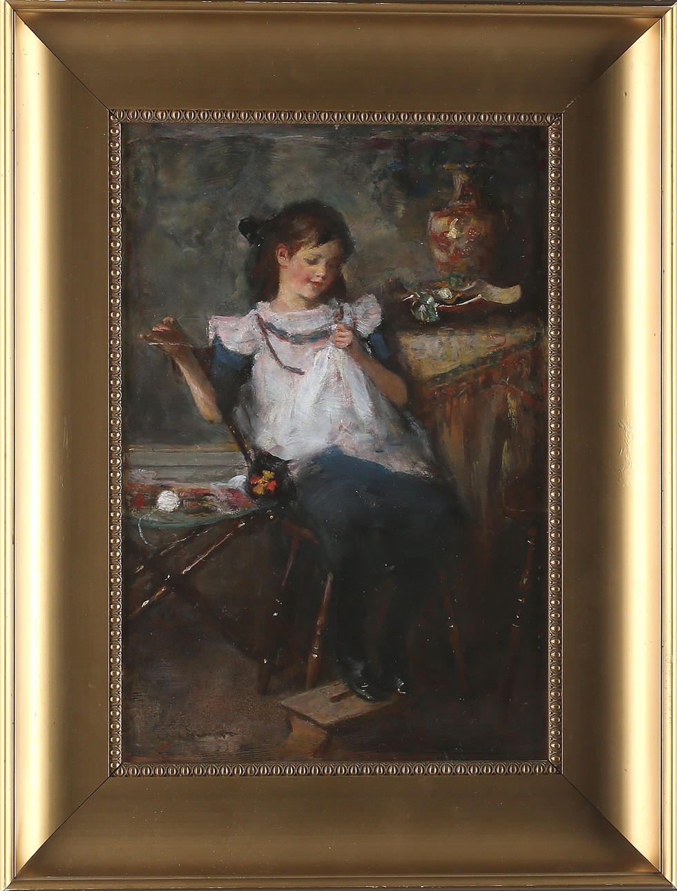 EMMA EKWALL. Interiör med sittande ung flicka, olja på pannå, otydligt signerad E Ekwall.