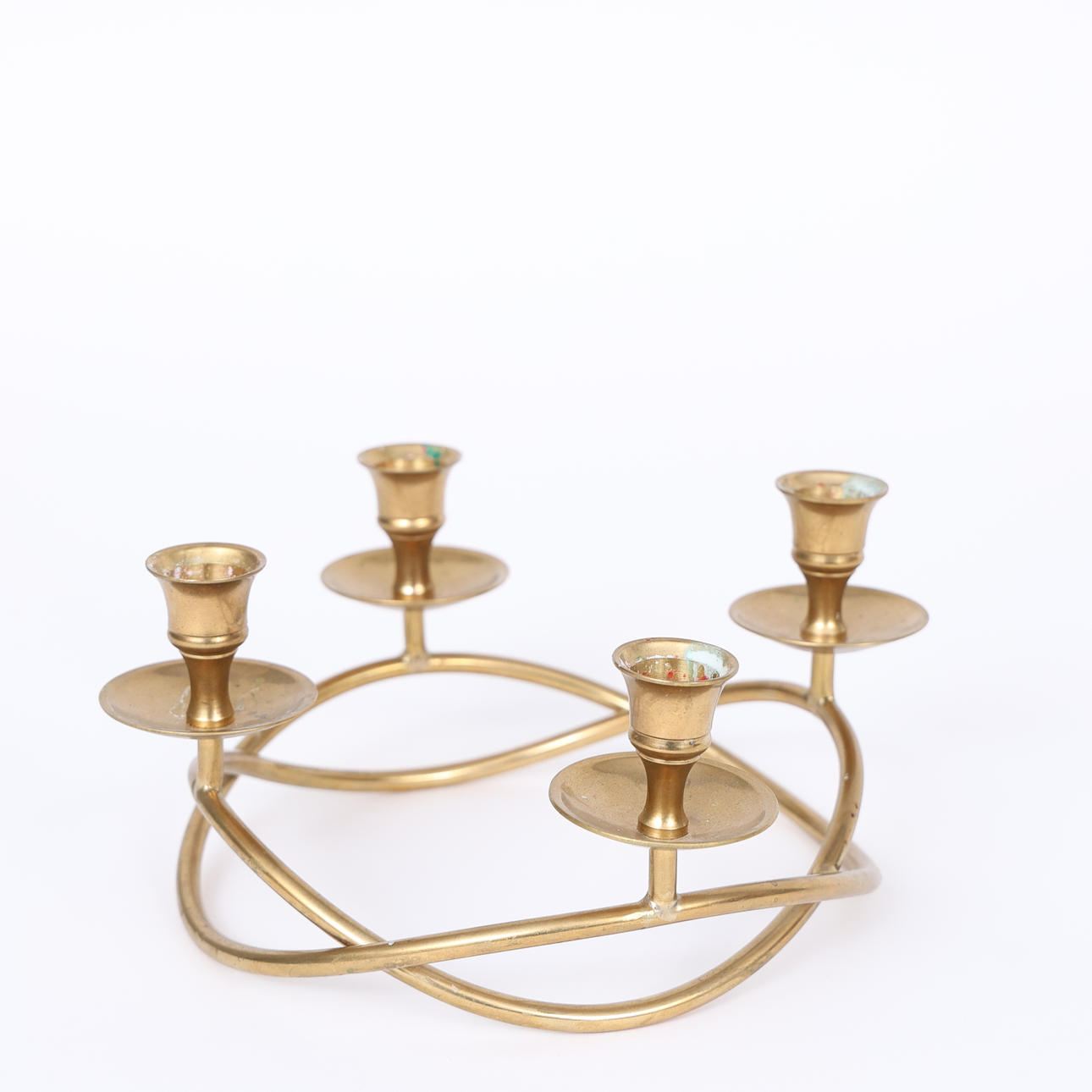 A brass candlestick, round, 20th century.