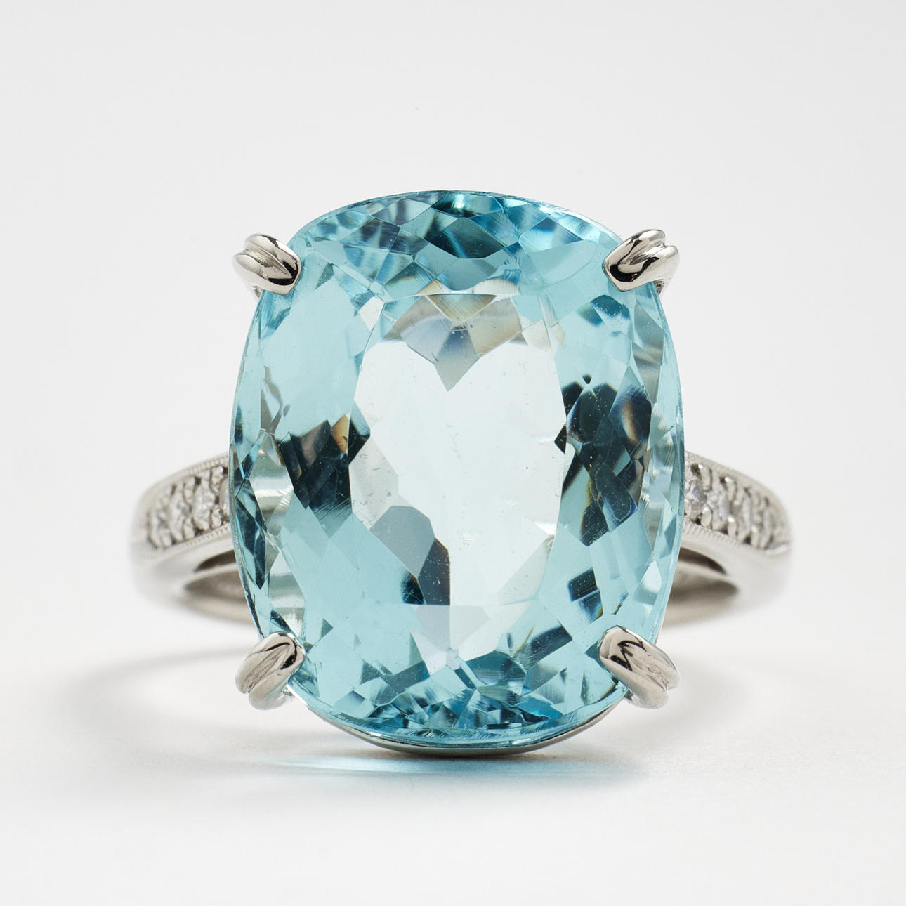 RING, platinum, 1 cushion cut aquamarine, approx. 12,06 ct, ring rail set with 8 diamonds with brilliant cut, total approx. 0,12 ct according to engraving.