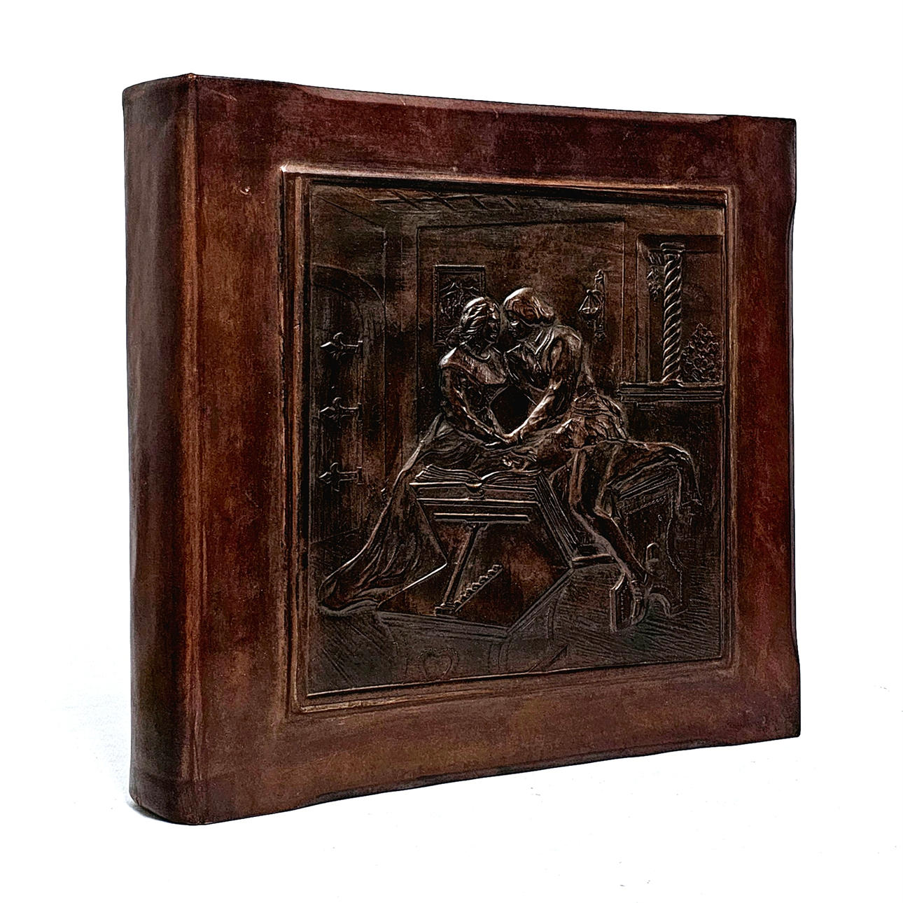 Embossed leather album with romantic scene.