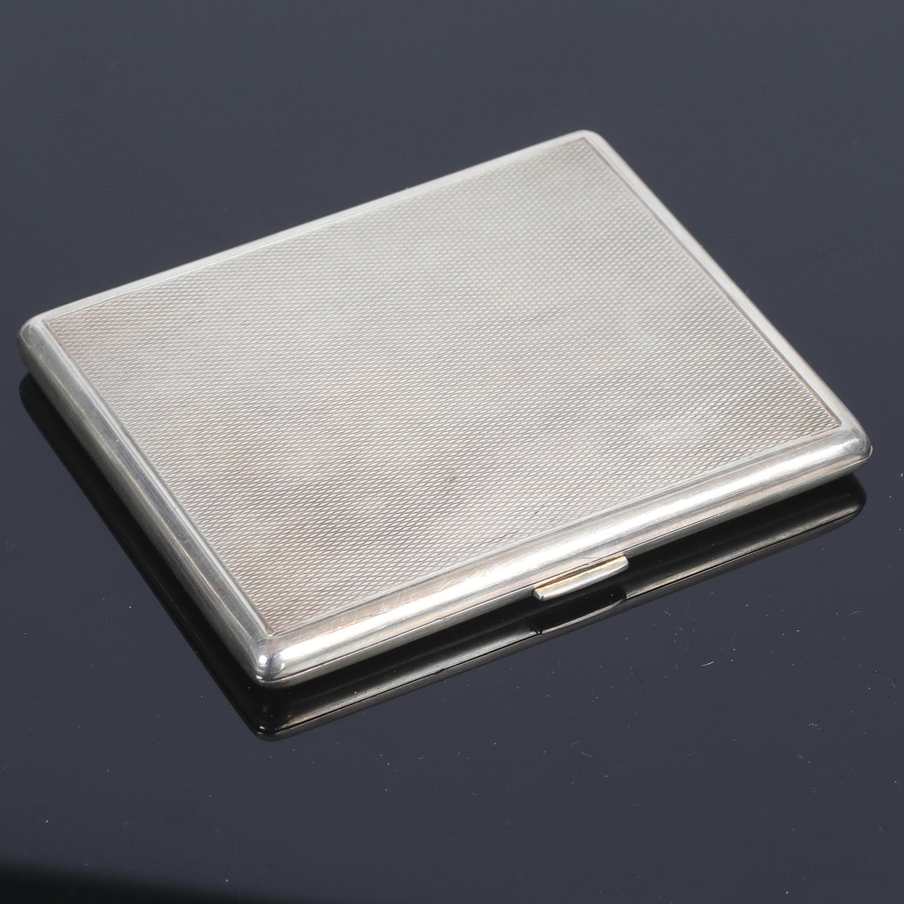 A silver cigarette case, Swedish import stamps, 20th century.