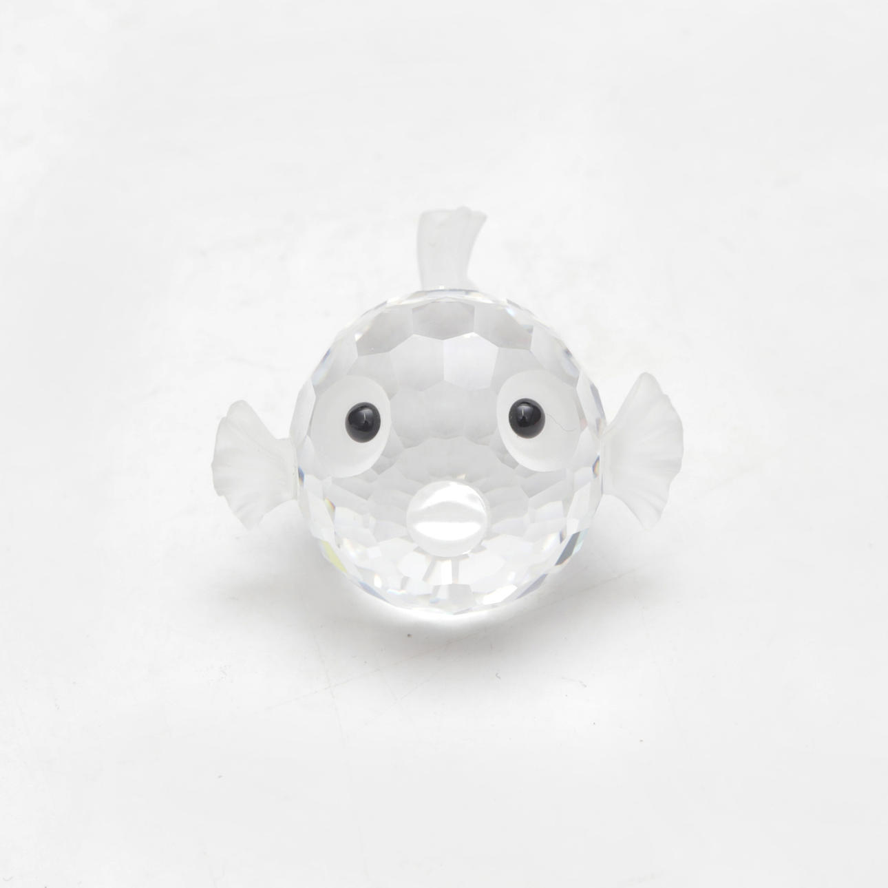 A Swarowski glass mini sculpture.