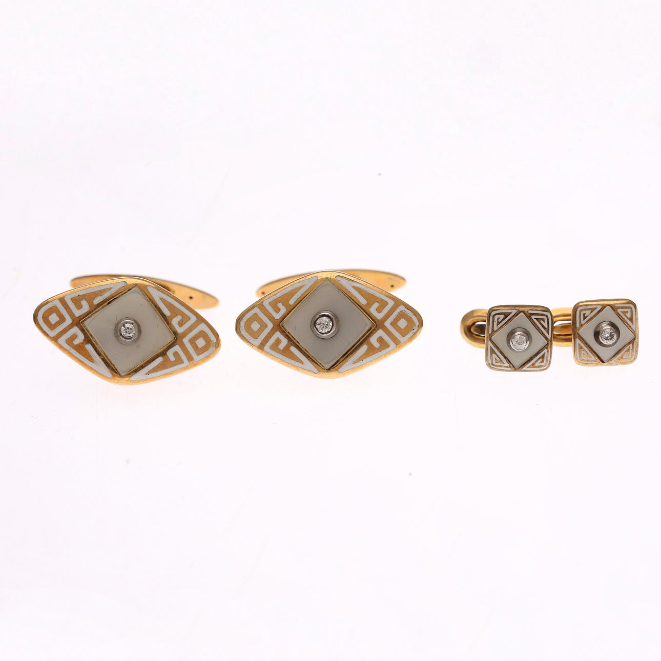Cufflinks and buttons set in gold and diamonds.
