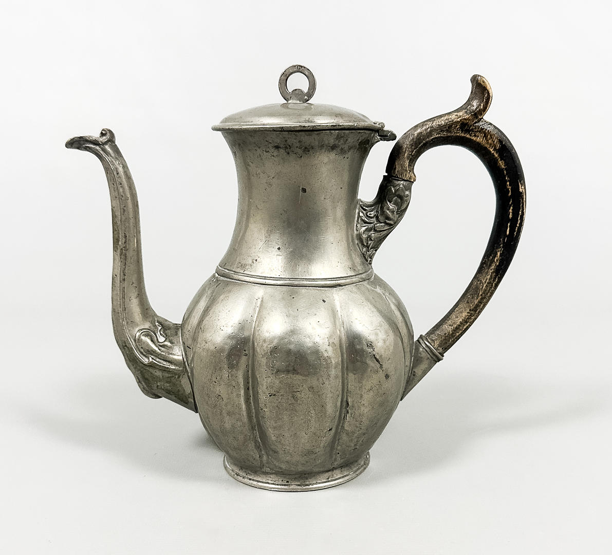 A tin coffee pot, probably 18th century.