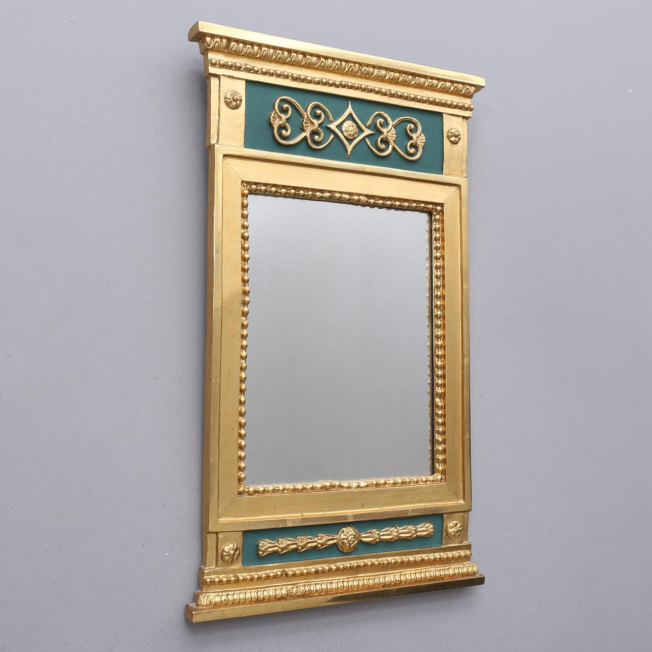 An empire mirror, 19th century.