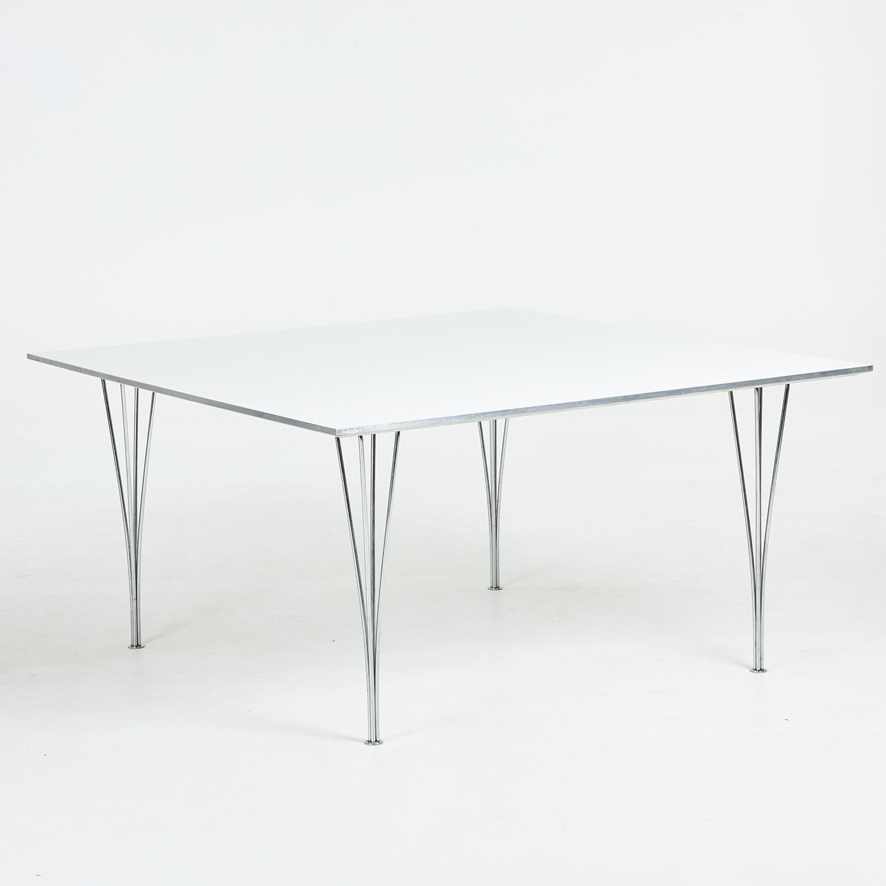 BRUNO MATHSSON & PIET HEIN. A table, Fritz Hansen, 1970s, square plate in white laminate with aluminium edge, chromed clamping legs, label marked Fritz Hansen 1979.