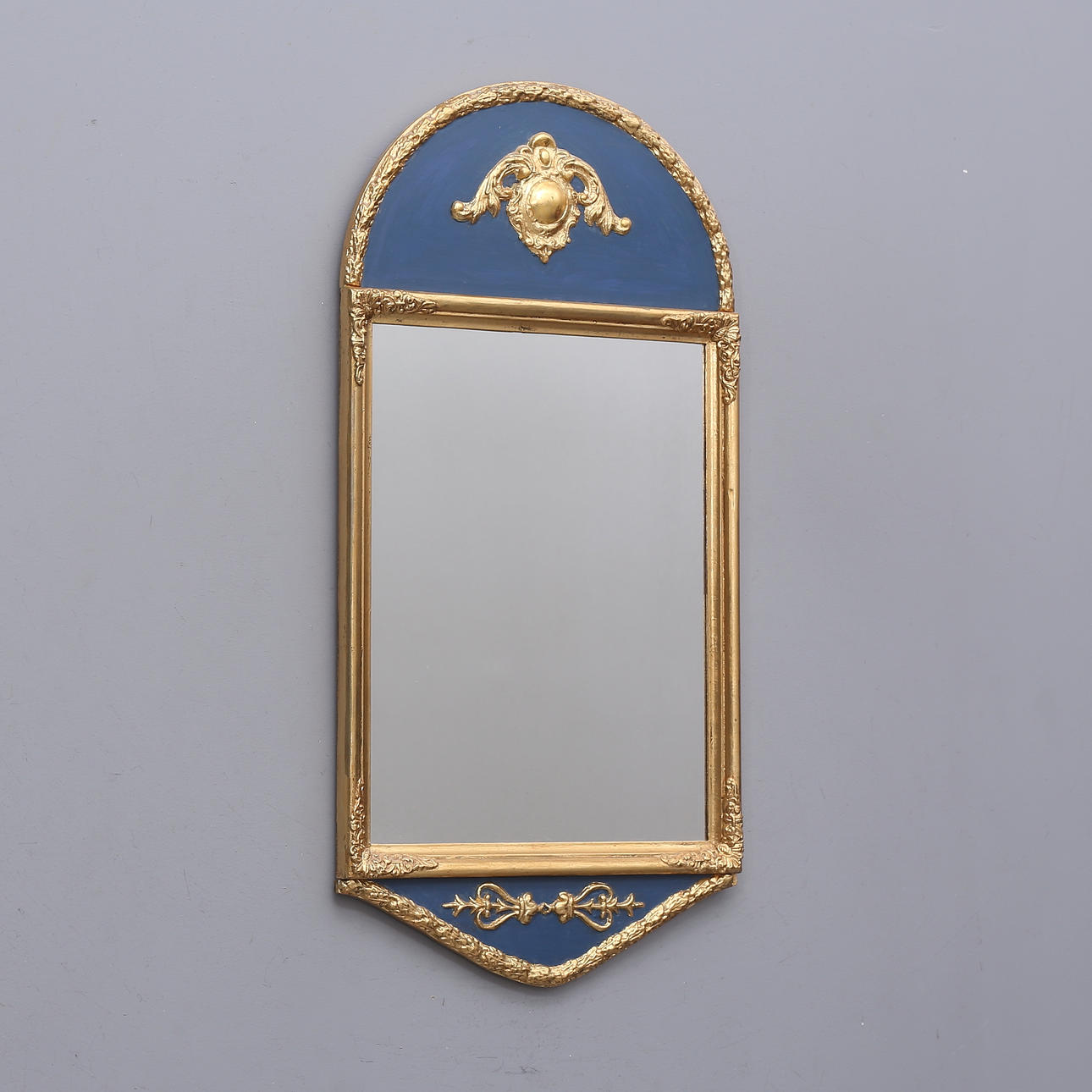 A 20th century Empire style mirror.