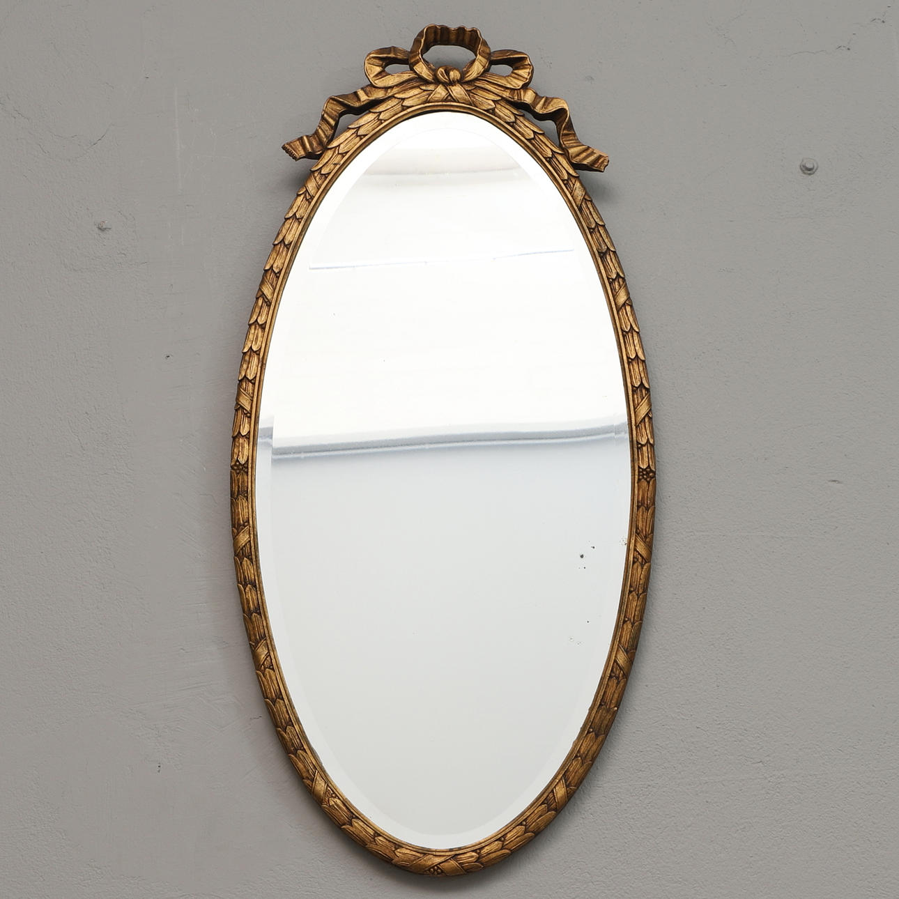MIRROR, gilded wooden frame, rosette crown.
