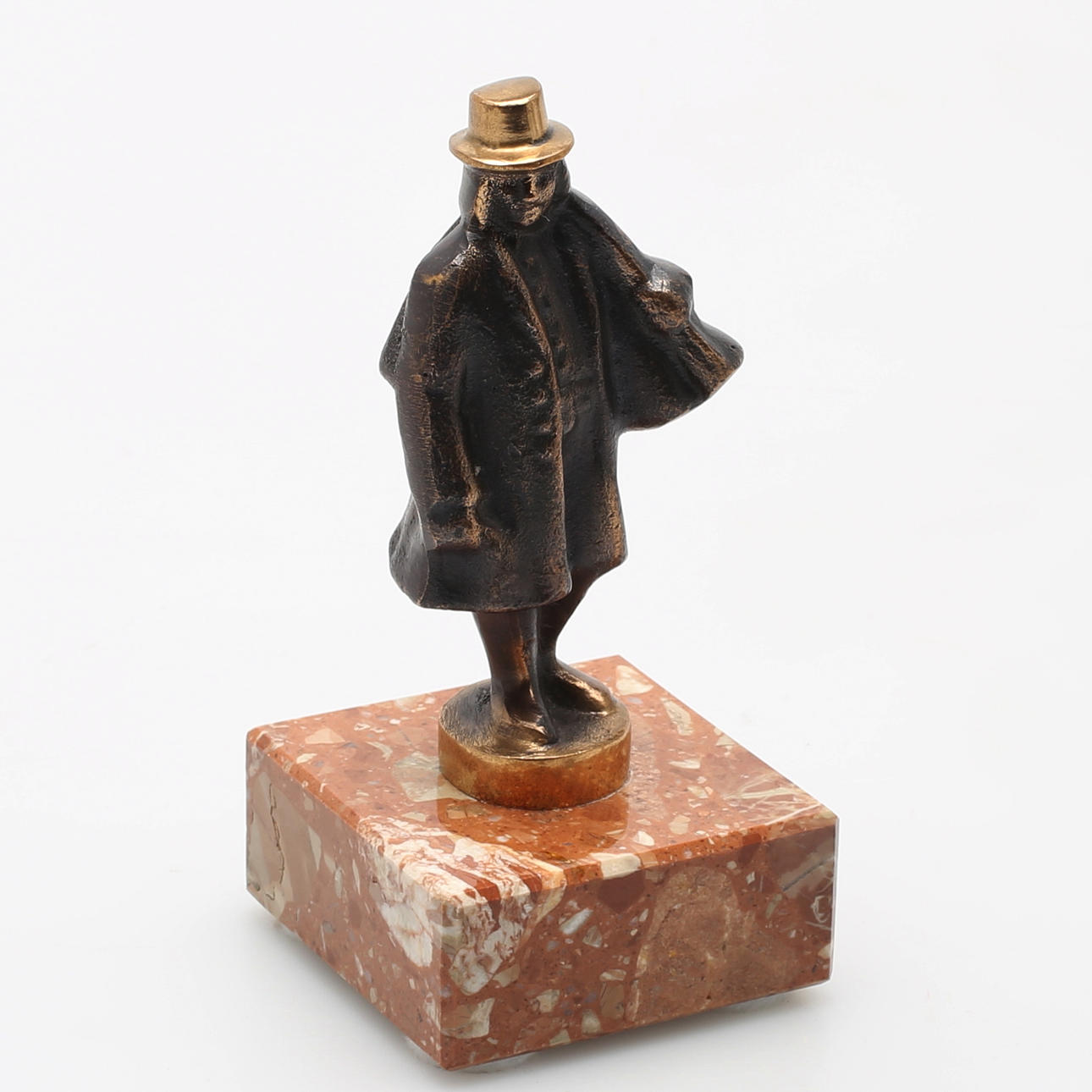 NILS CASTEGREN. "Knallen" Skulptur i patinerad brons på marmorsockel. Monogramsignerad.