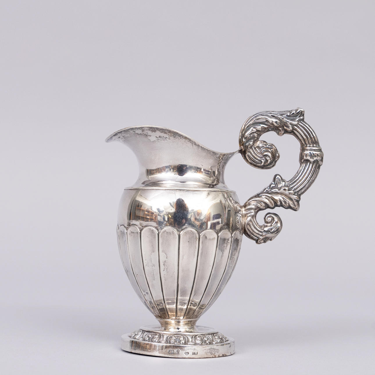 A SILVER CREAM JUG, Gustaf Möllenborg, 1838.