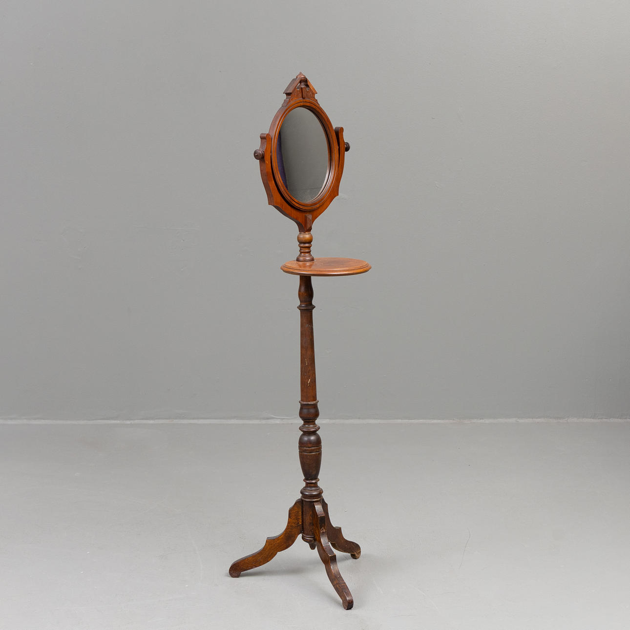 A mahogany shaving mirror, 20th century.