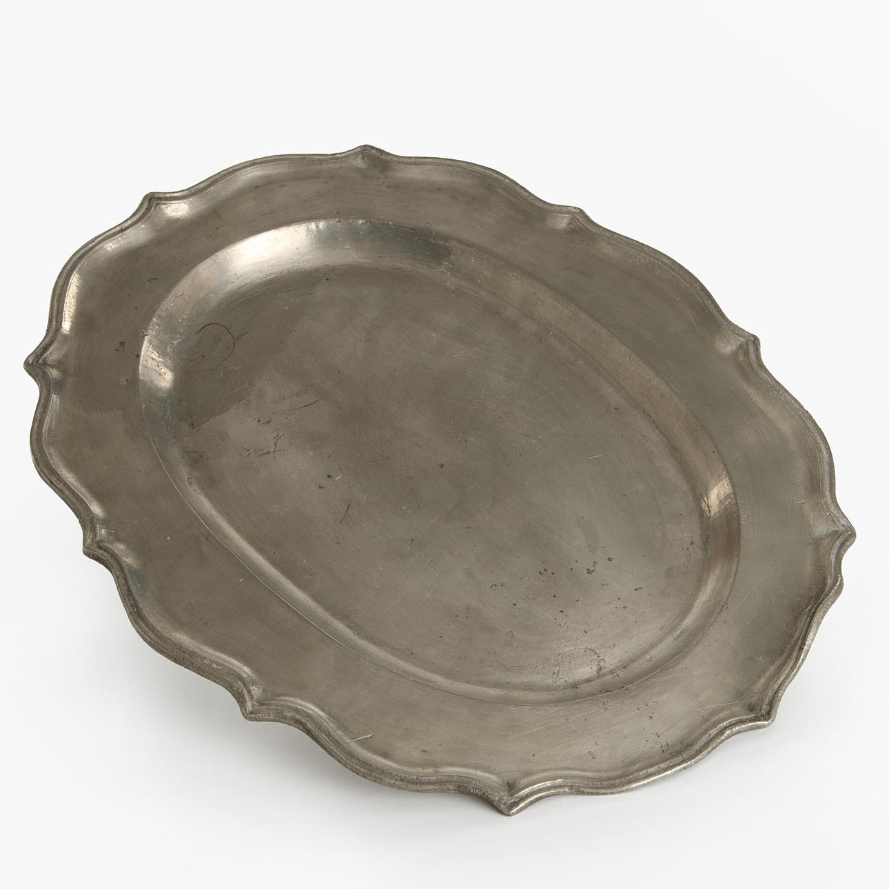 A tin, rococo style tin, marked Stockholm.