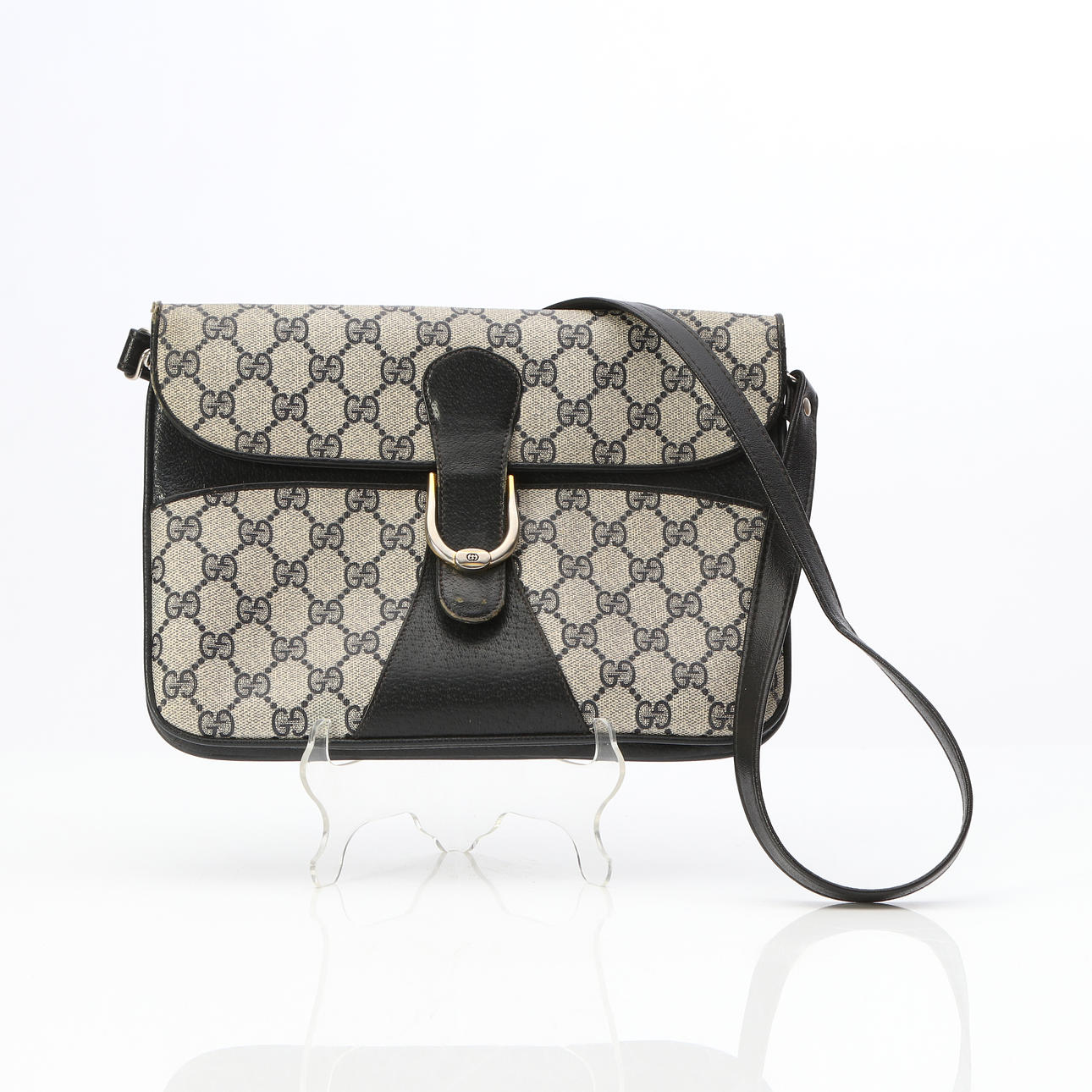 GUCCI, ENVELOPE BAG. Monogram canvas with black leather.
