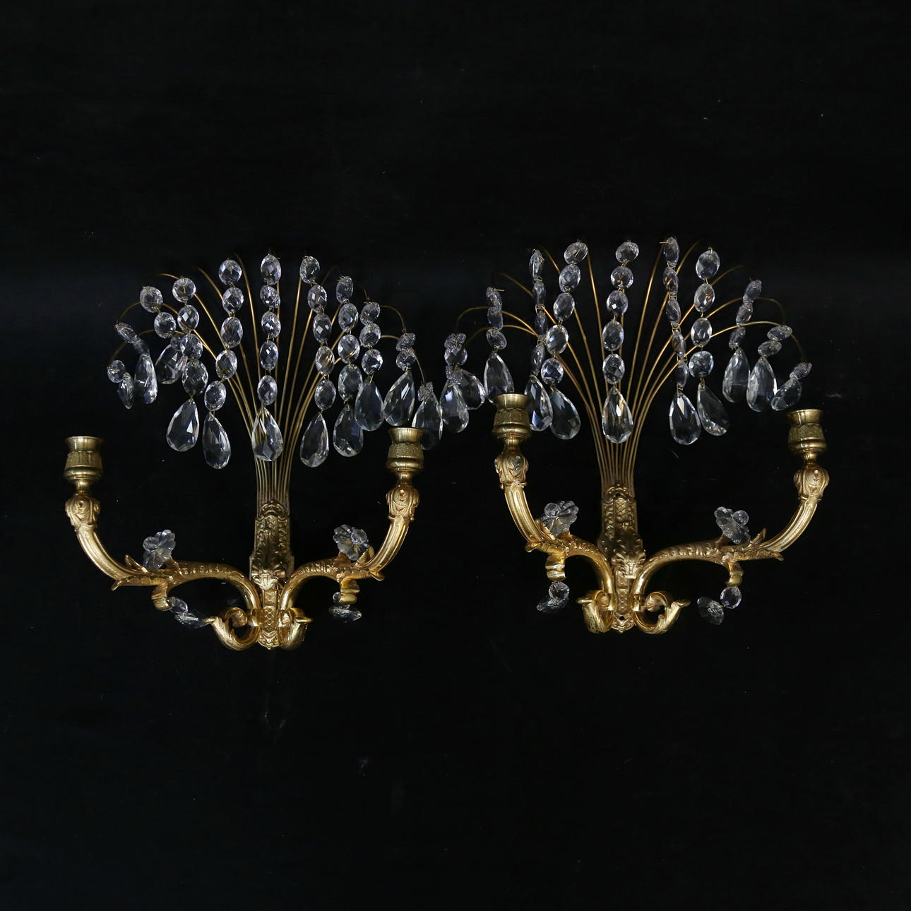 A pair of brass appliques, 20th century.