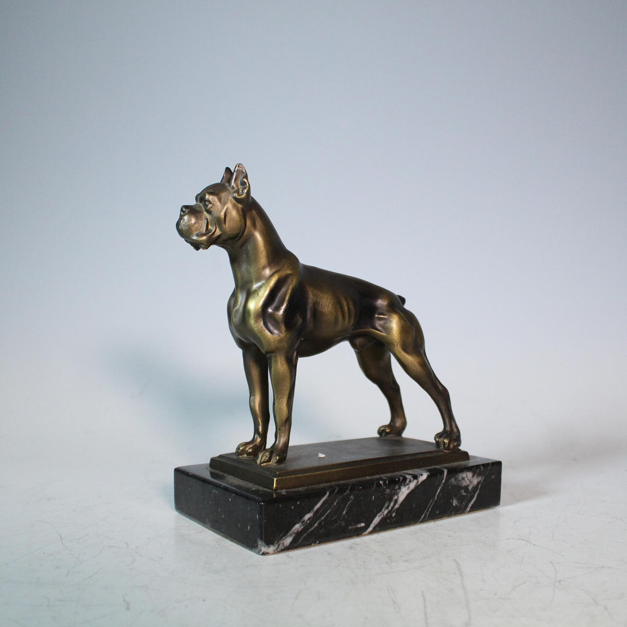 sculpture on marble base, “Boxer” brass.
