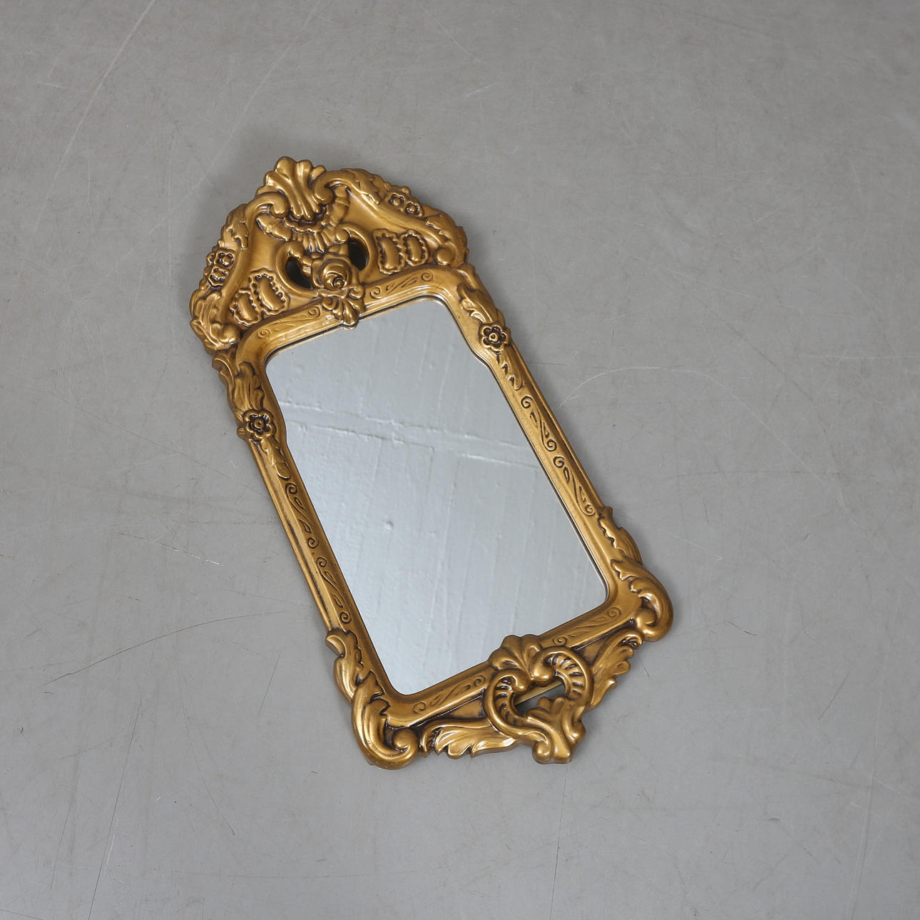 A 1900 rococo style mirror.