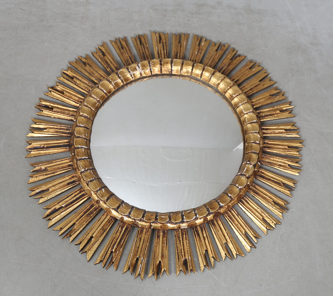 A wooden sun mirror, probably Italy.