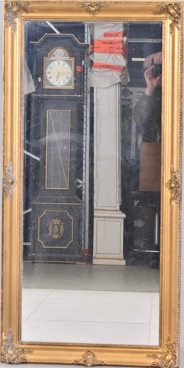 A mirror, bronzed wood, 20th century.