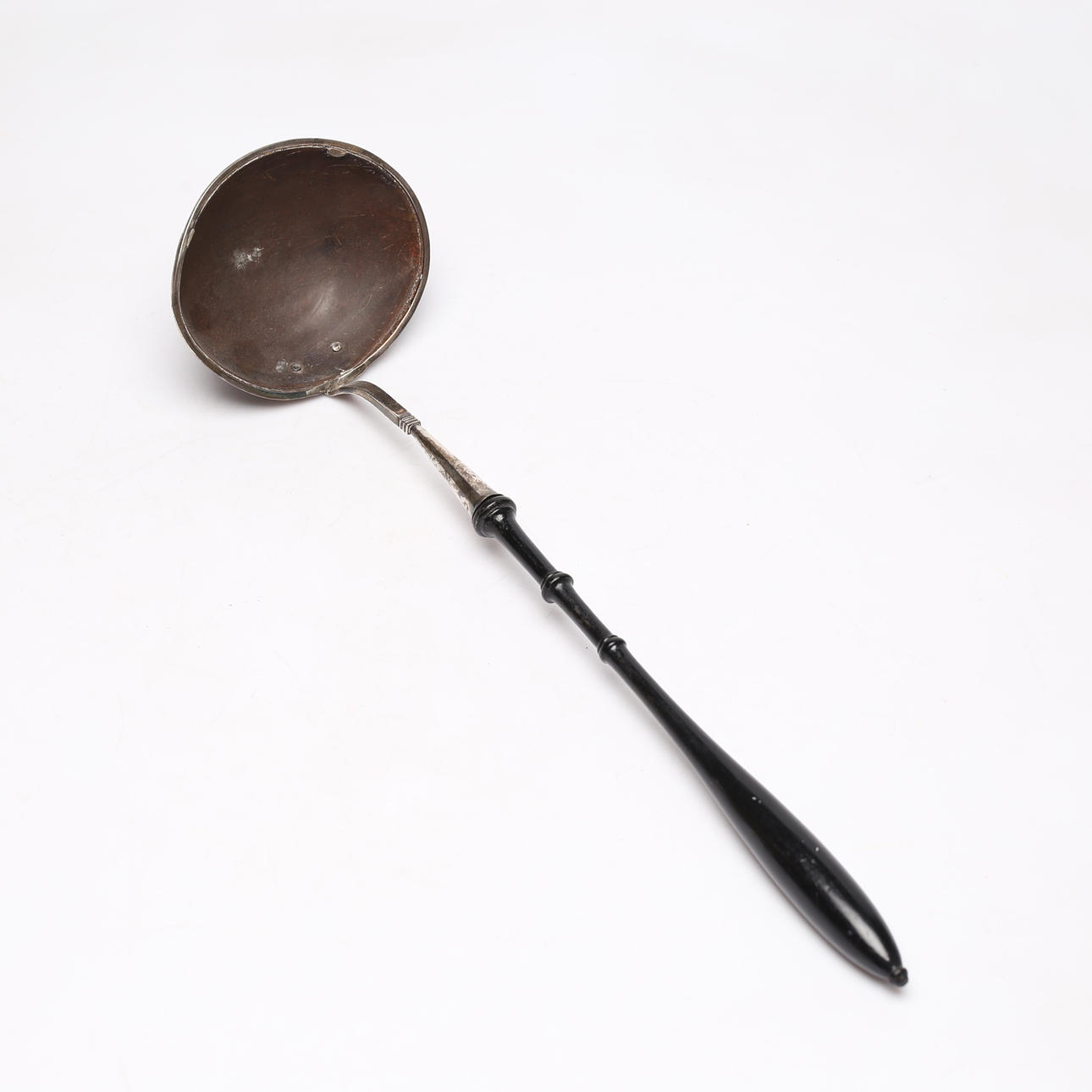 A silver soup spoon with coconut, 19th century.