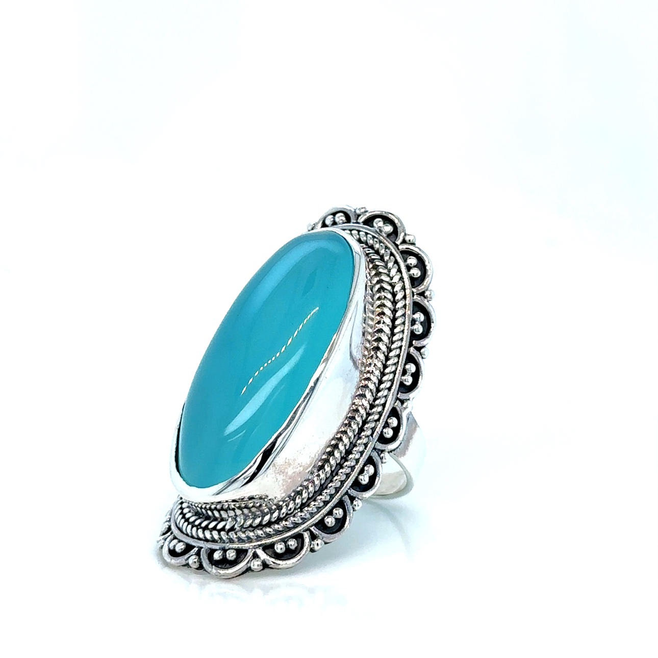 SØLVRING med stor lyseblå sten.