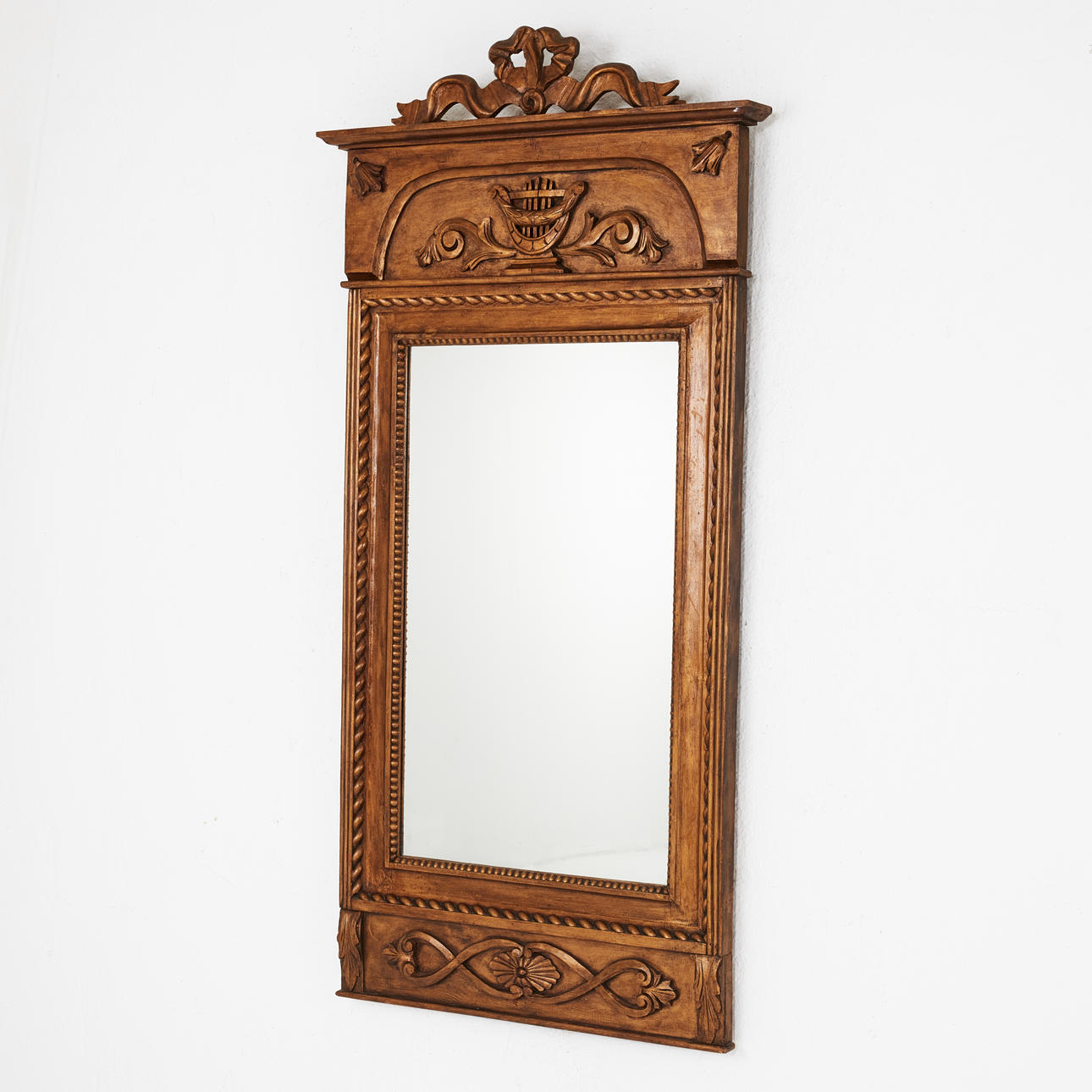 A mid 20th century Empire style mirror.