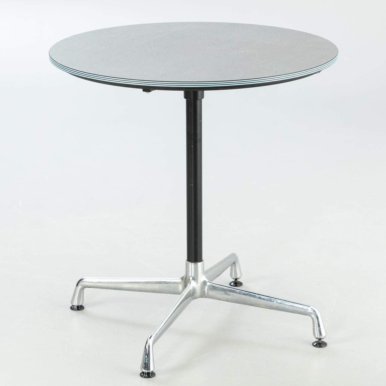Bistro table with Charles and Ray Eames, Vitra segmented table frame.