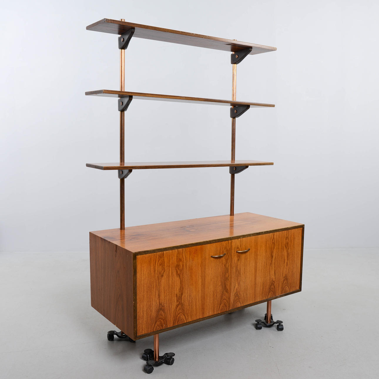 A bookcase, CE Christianson, Three Men, 1960s.