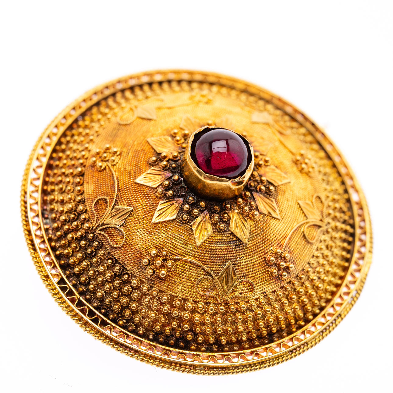 gold brooch.