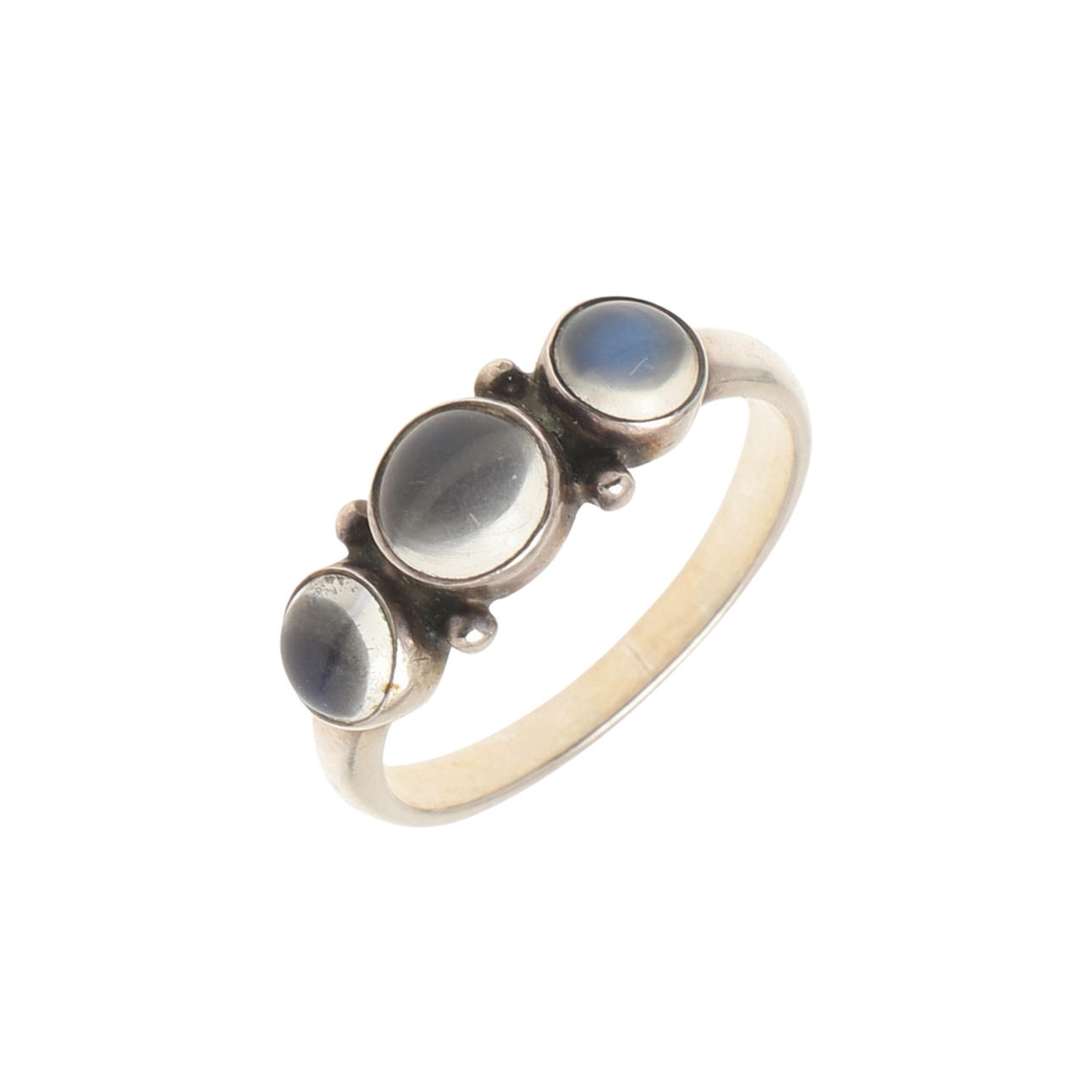 A MOONSTONE AND SILVER THREE STONE RING BY GEORG JENSEN.
