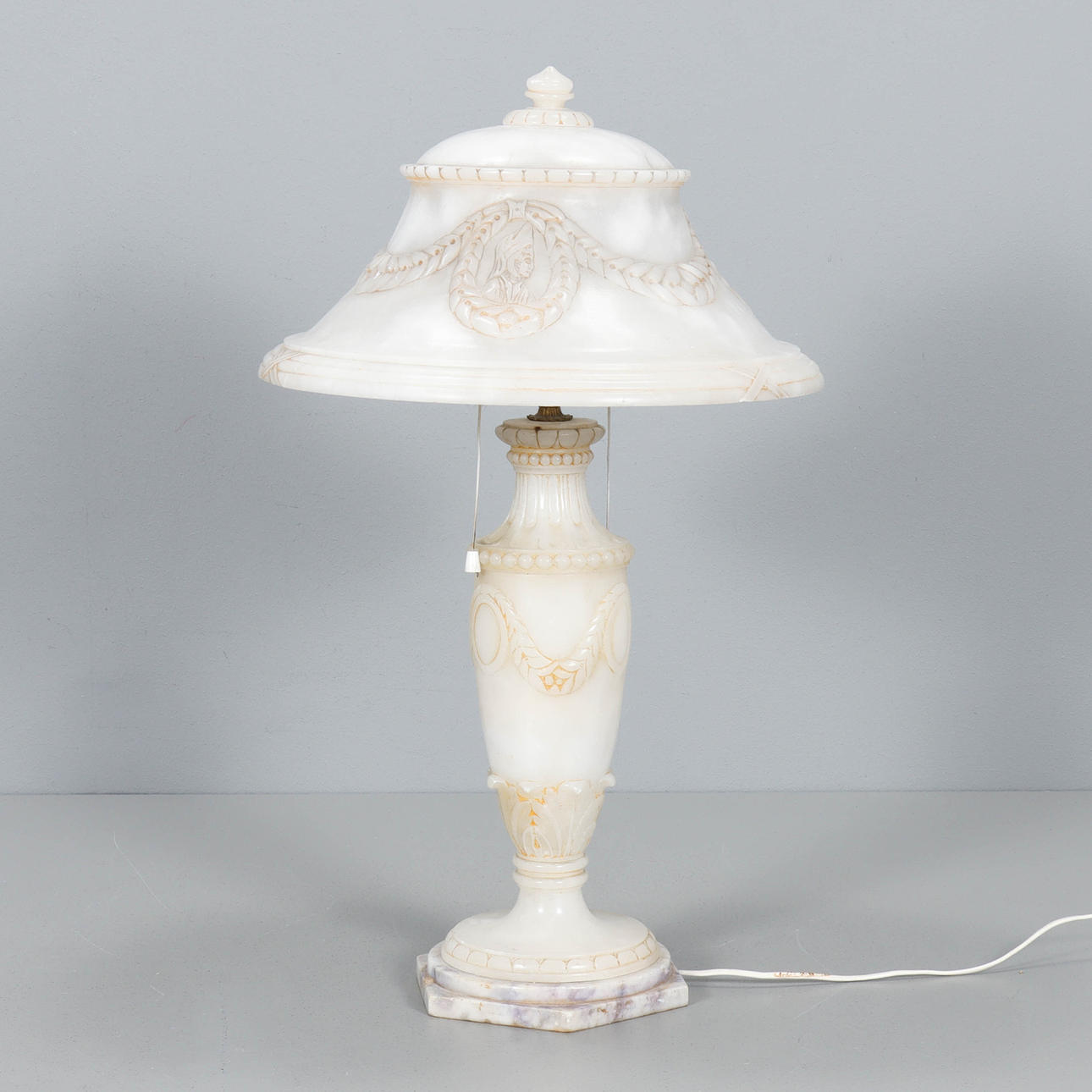 A mid-20th century alabaster table lamp.