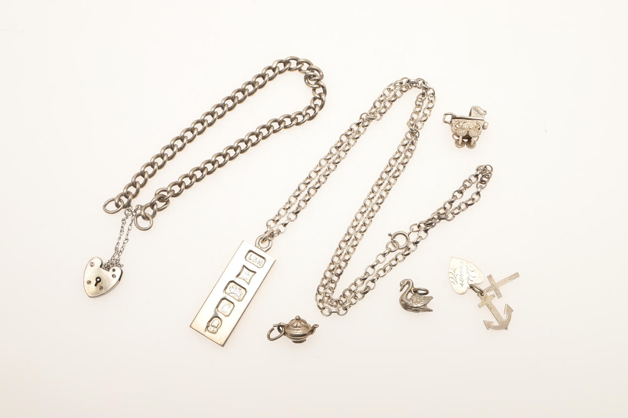 A SILVER INGOT PENDANT, AND OTHER SILVER ITEMS.