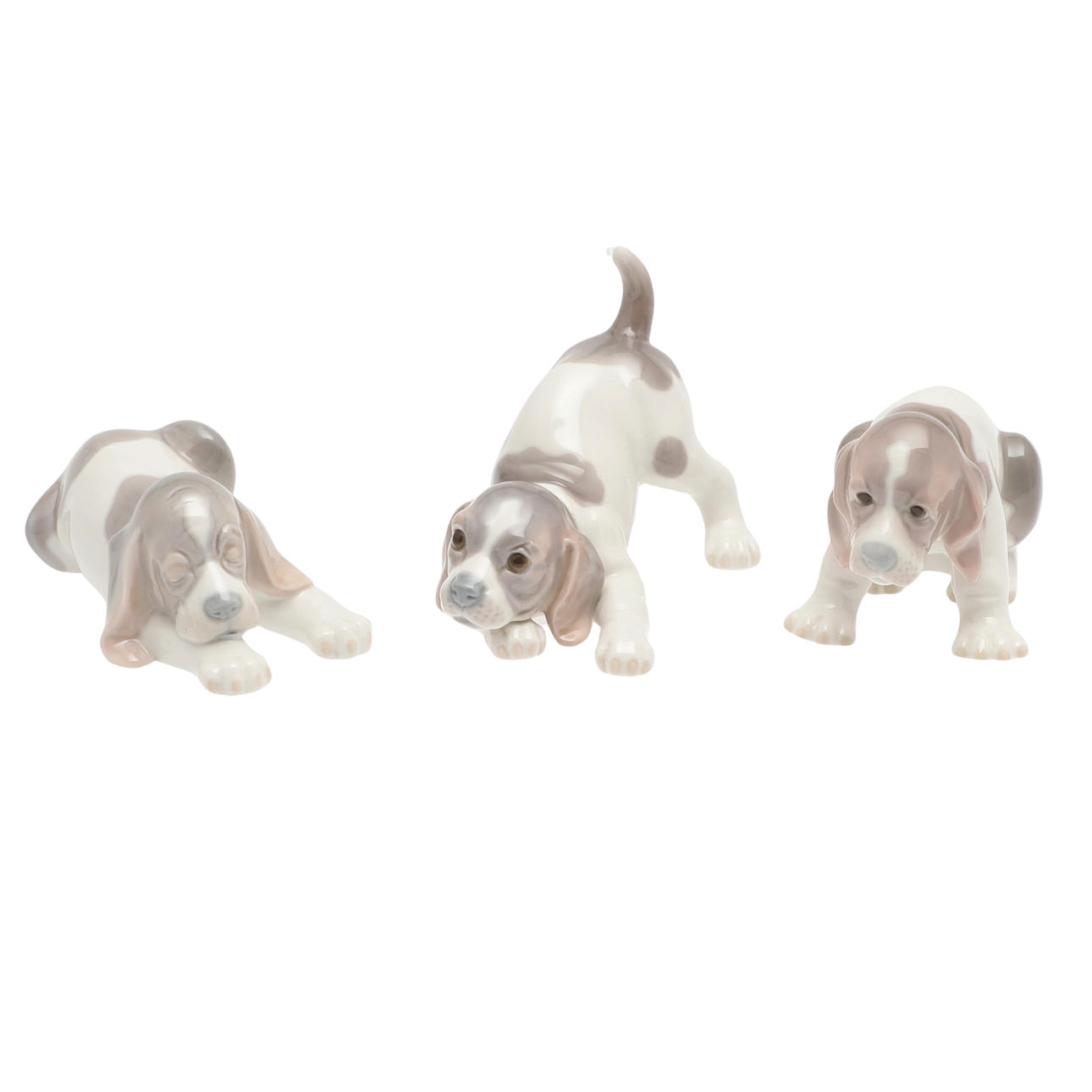 THREE LLADRO PLAYFUL PUPPY FIGURES.