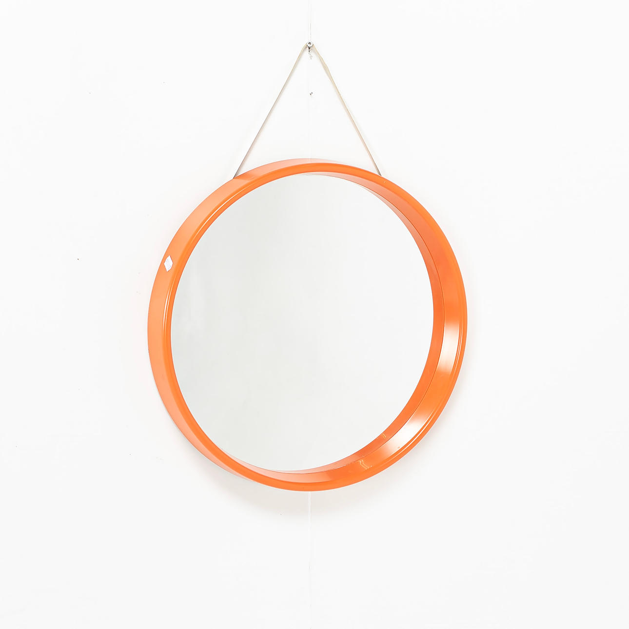 A mirror, Orange plastic, 60/70's.