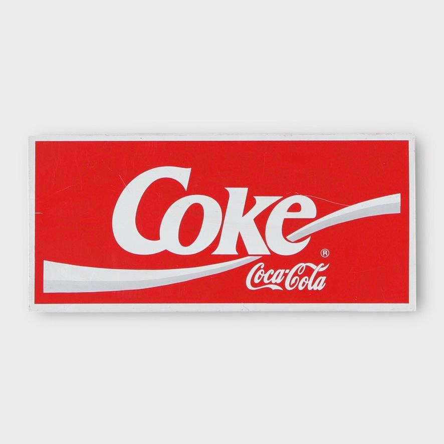 A metal “Coca Cola” sign, contemporary.