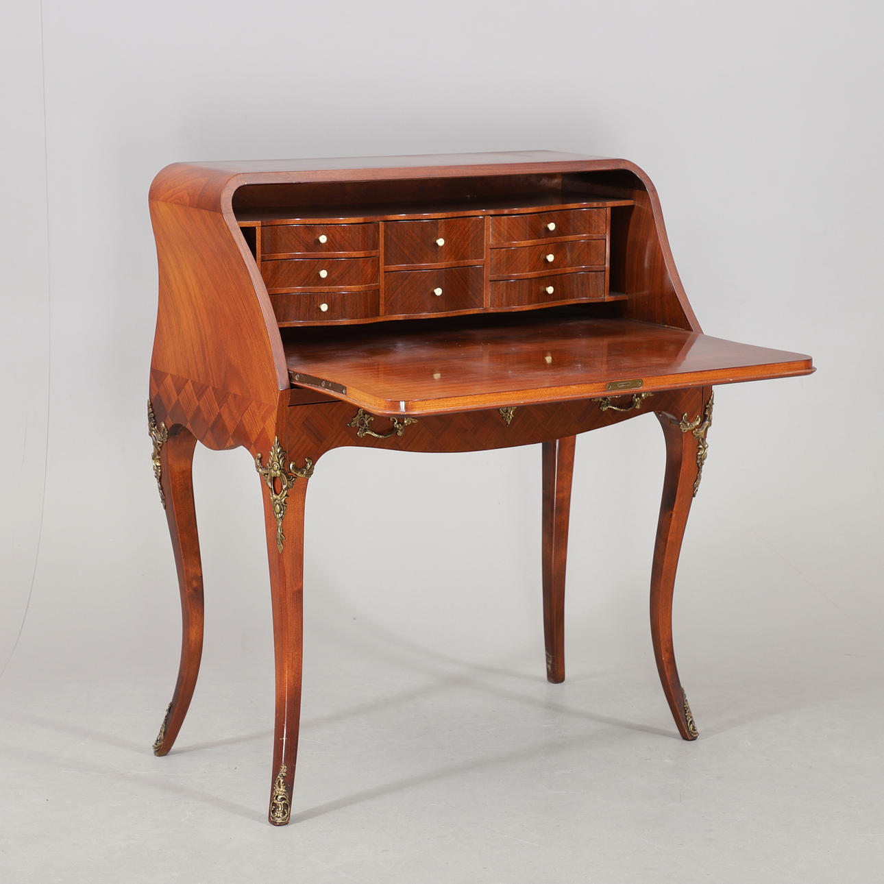 A 20th century Rococo style secretary.