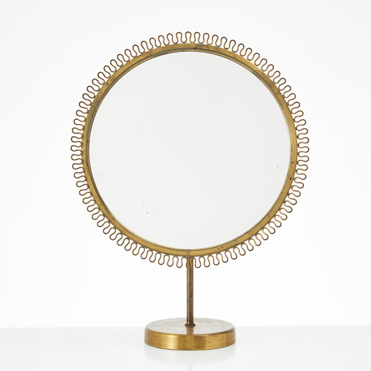 A Swedish modern brass table mirror, 1940s.